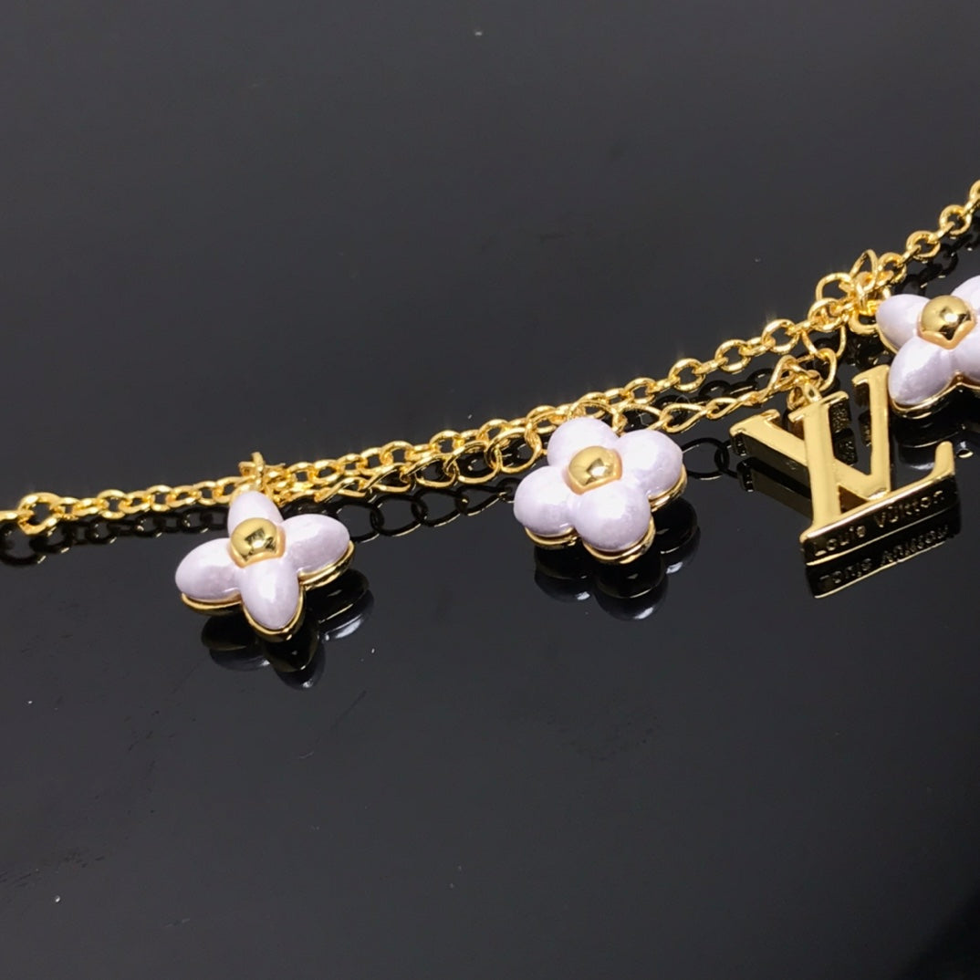 Pomuse LOGO 6 MOTIF STAR AND SUN GOLD BRACELET