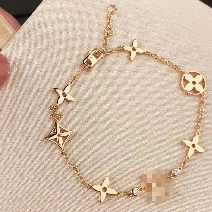 Pomuse STAR AND SUN 7 MOTIFS GOLD BRACELET